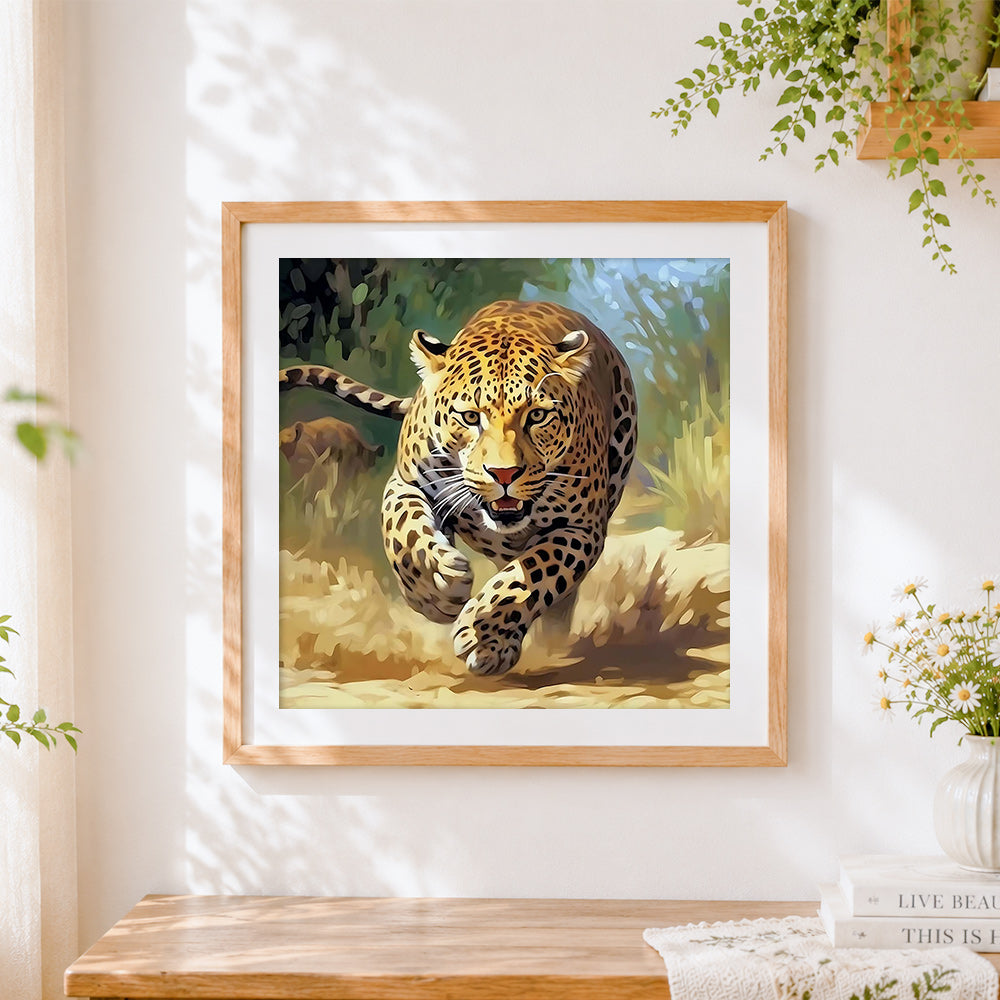 Finished leopard sprinting at full speed cross stitch artwork displayed
