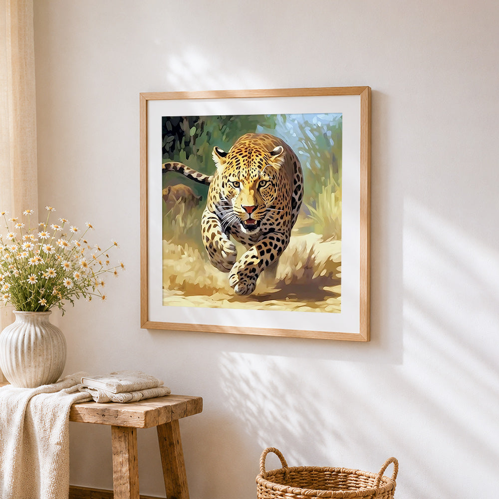 Leopard sprinting at full speed cross stitch artwork displayed on wall as home decor