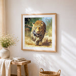 Leopard sprinting at full speed cross stitch artwork displayed on wall as home decor