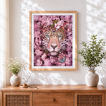 Finished leopard surrounded by pink blossoms paint by numbers artwork displayed as home decor