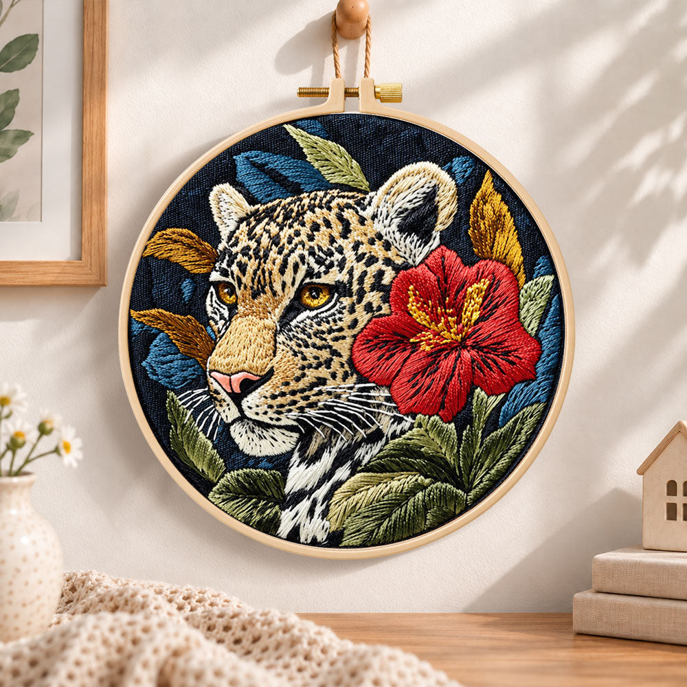 Leopard with red hibiscus embroidery hoop wall art displayed as warm and cosy handmade home decor