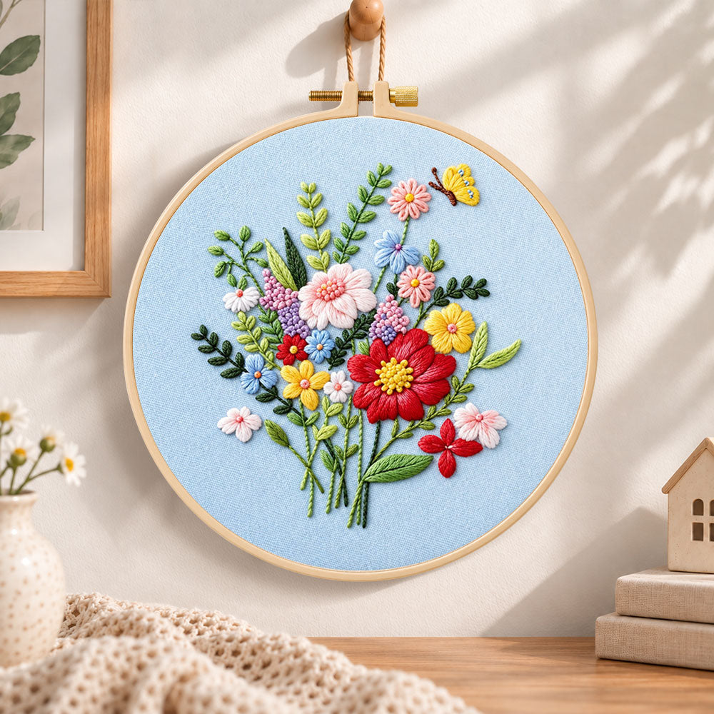 Light blue florals with butterfly embroidery hoop wall art displayed as warm and cosy handmade home decor