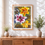 Finished lilies on swirling background cross stitch artwork displayed