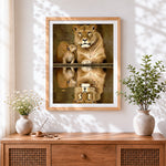 Finished lioness and cub reflection cross stitch artwork displayed