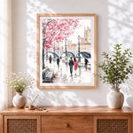 Finished london cherry blossom and pedestrians cross stitch artwork displayed