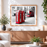 Finished london red telephone boxes and bus cross stitch artwork displayed
