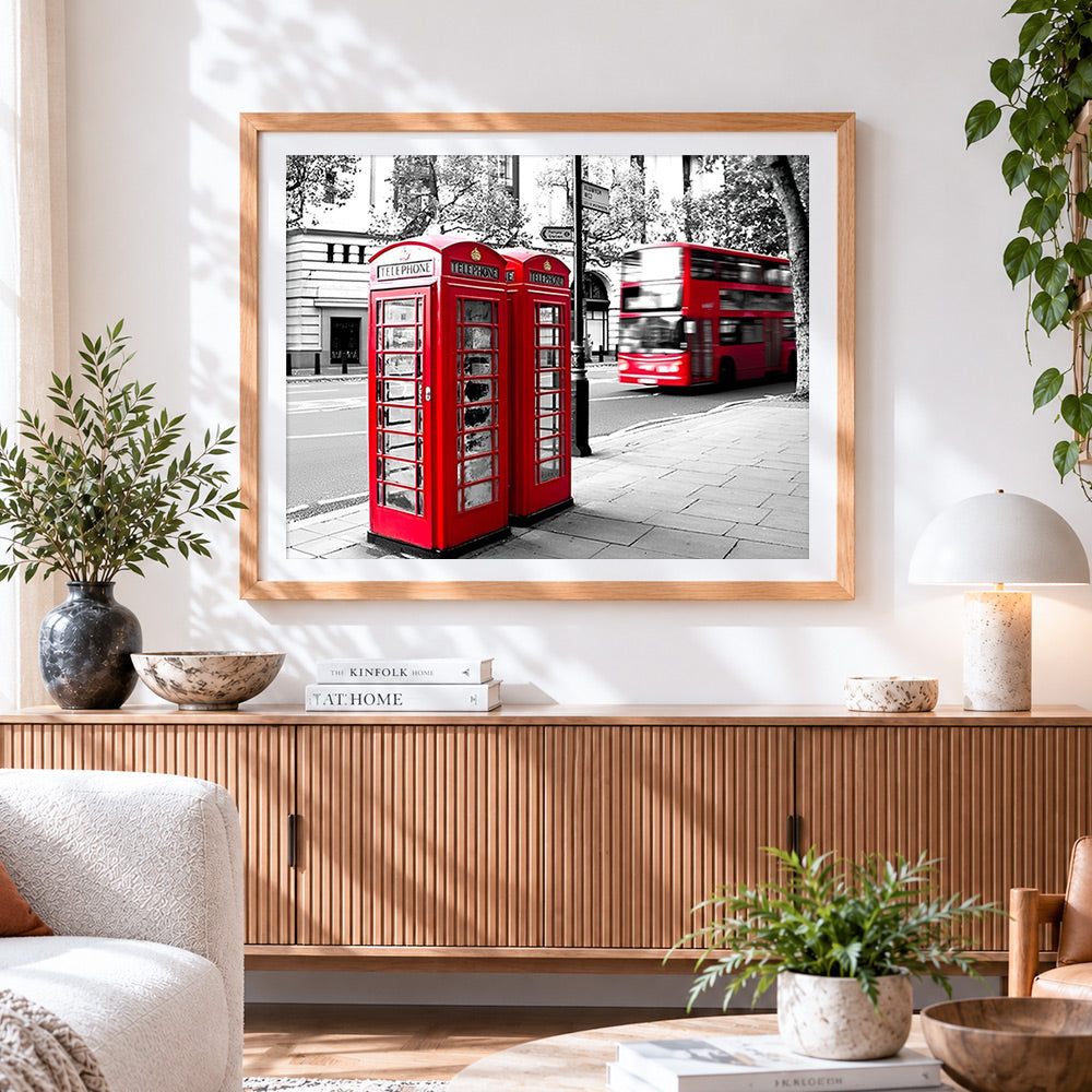 Finished london red telephone boxes and bus cross stitch artwork displayed