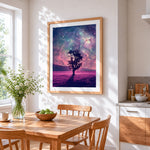 Lone tree under a pink galaxy cross stitch artwork displayed on wall as home decor