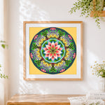 Finished lotus flower and green leaves mandala cross stitch artwork displayed