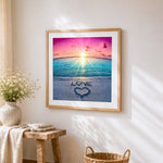 "Love" written in sand with heart paint by numbers artwork displayed on wall as home decor