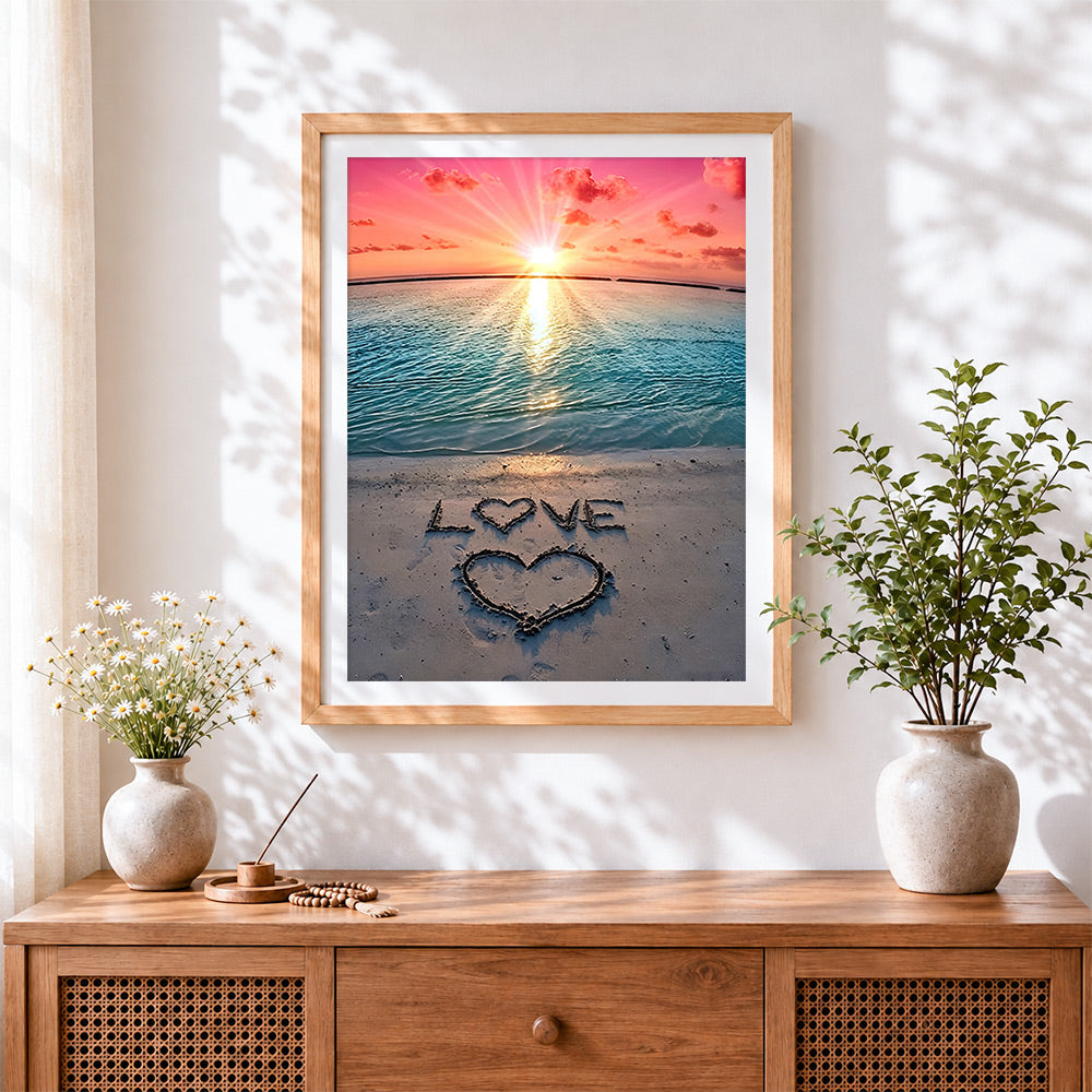 Finished love written in the sand cross stitch artwork displayed