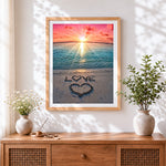 Finished love written in the sand cross stitch artwork displayed