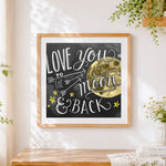 Finished love you to the moon and back chalkboard print cross stitch artwork displayed