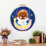 Finished lovely space bear on a moon swing artwork displayed on a wall
