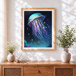 Finished luminous blue jellyfish in deep ocean cross stitch artwork displayed