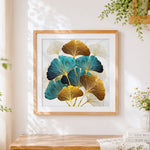 Finished luxurious gold and teal ginkgo leaves cross stitch artwork displayed