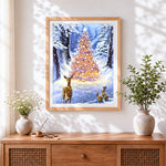 Finished magical glowing christmas tree and deer cross stitch artwork displayed