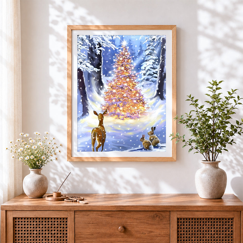 Finished magical glowing christmas tree and deer cross stitch artwork displayed