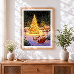 Finished magical glowing christmas tree and sleigh cross stitch artwork displayed