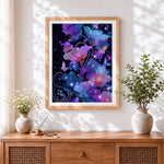 Finished magical glowing flowers and butterflies cross stitch artwork displayed