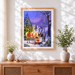 Finished magical glowing reindeer and christmas tree cross stitch artwork displayed