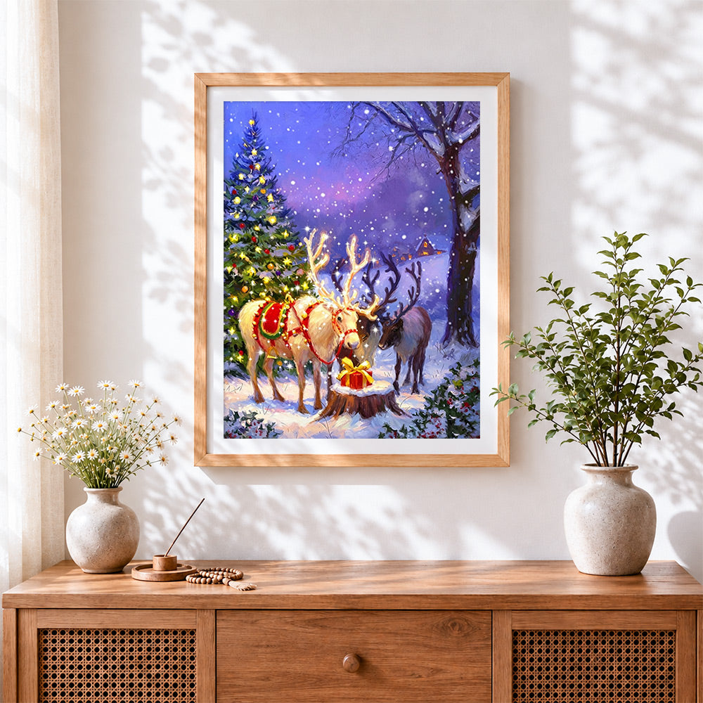 Finished magical glowing reindeer and christmas tree cross stitch artwork displayed