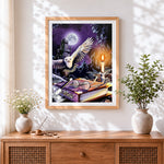 Finished magical owl wand and spellbook cross stitch artwork displayed
