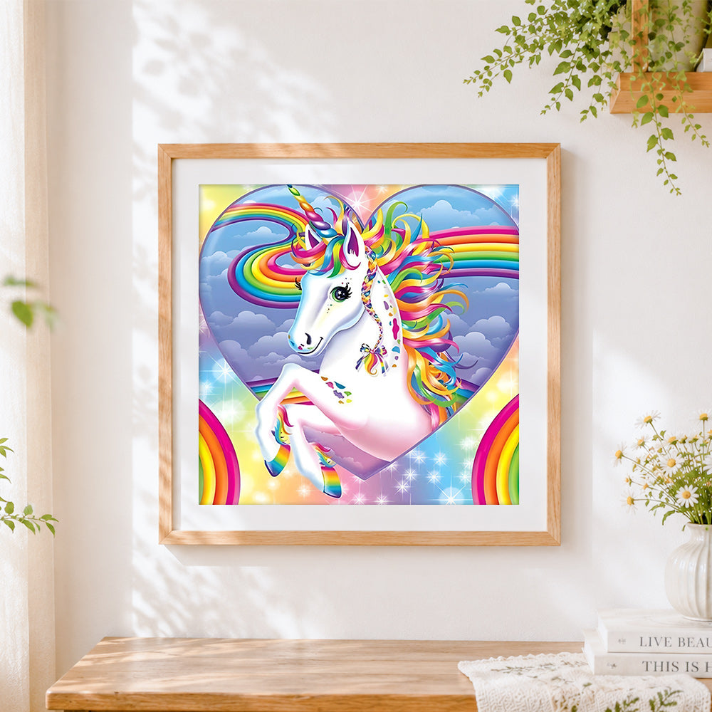 Finished magical rainbow unicorn in heart cross stitch artwork displayed