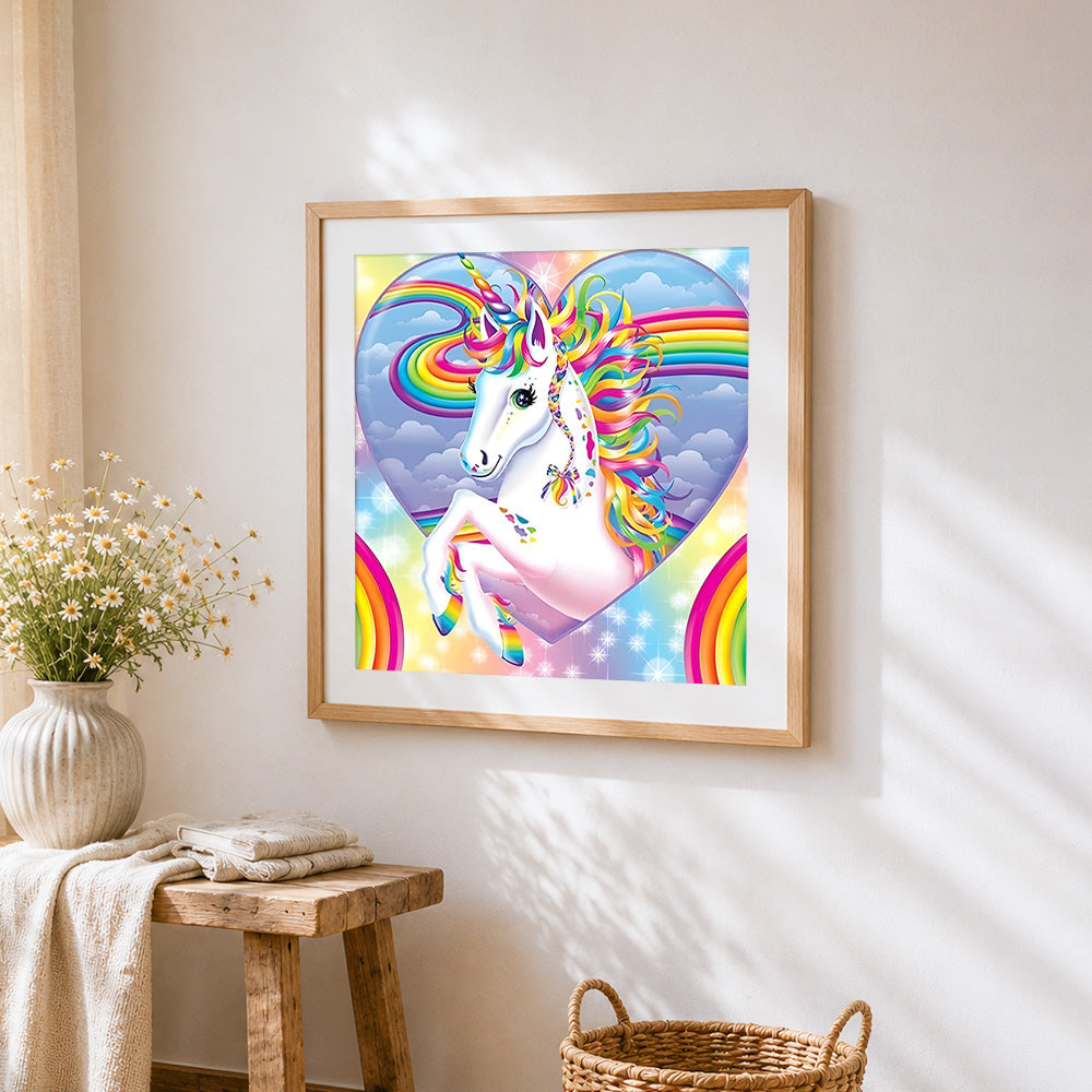 Magical rainbow unicorn in heart cross stitch artwork displayed on wall as home decor