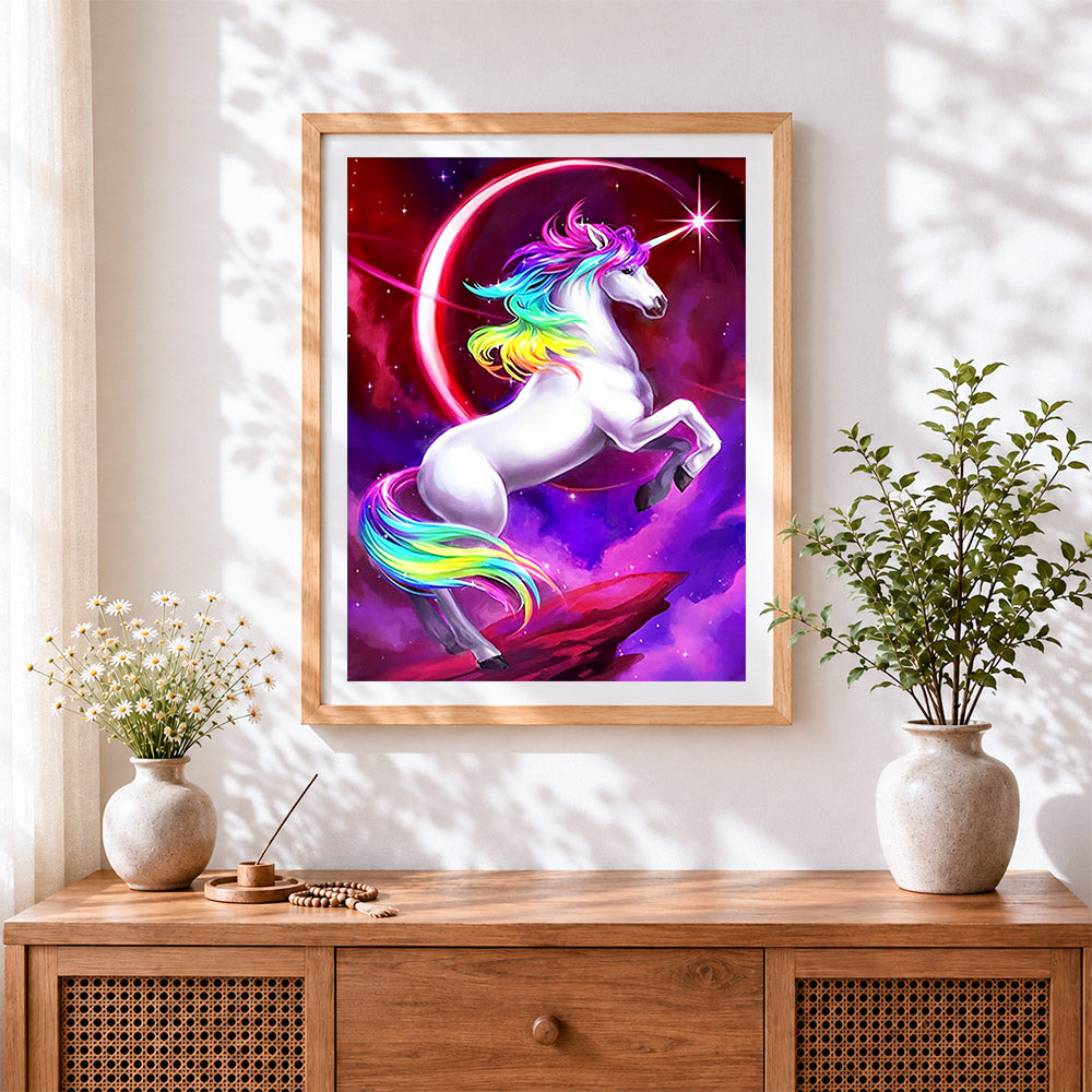 Finished magical rainbow unicorn in space cross stitch artwork displayed