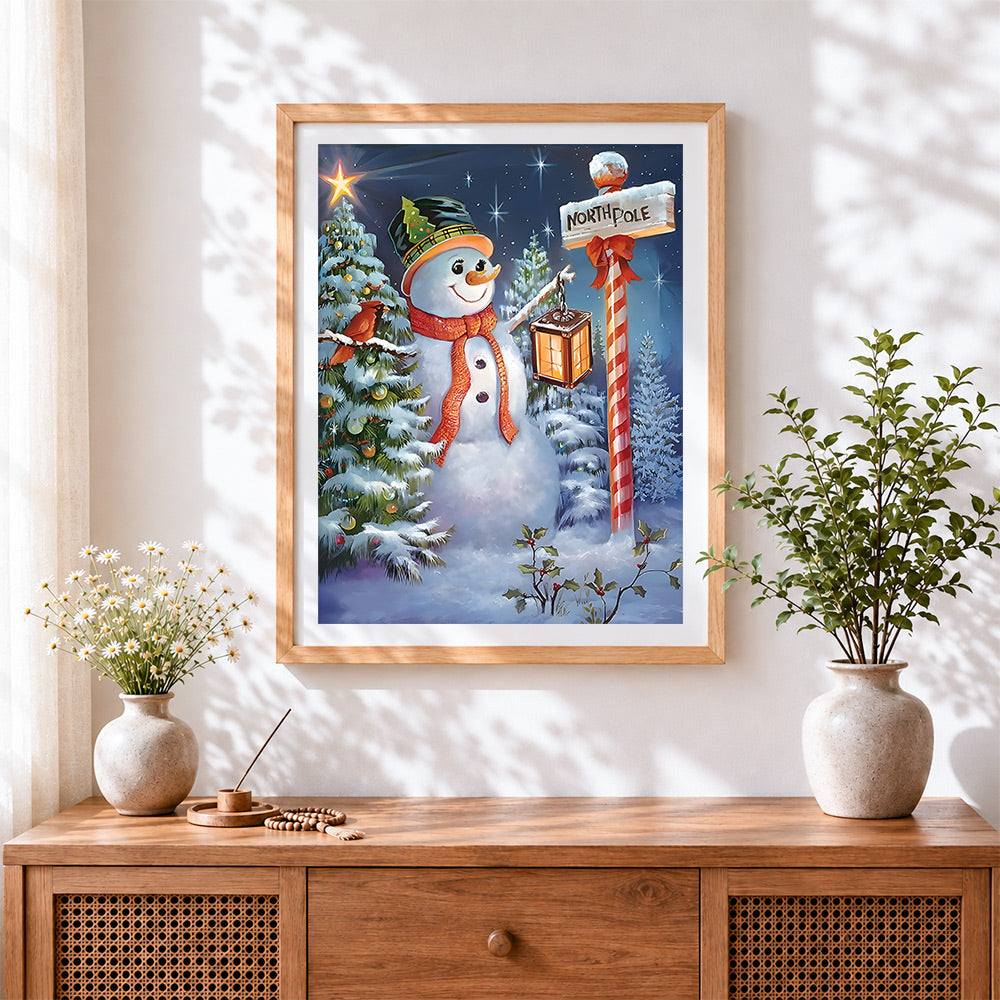 Finished magical snowman with lantern cross stitch artwork displayed