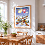 Magical snowy christmas village with fireworks cross stitch artwork displayed on wall as home decor
