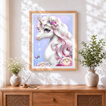 Finished magical unicorn with roses cross stitch artwork displayed
