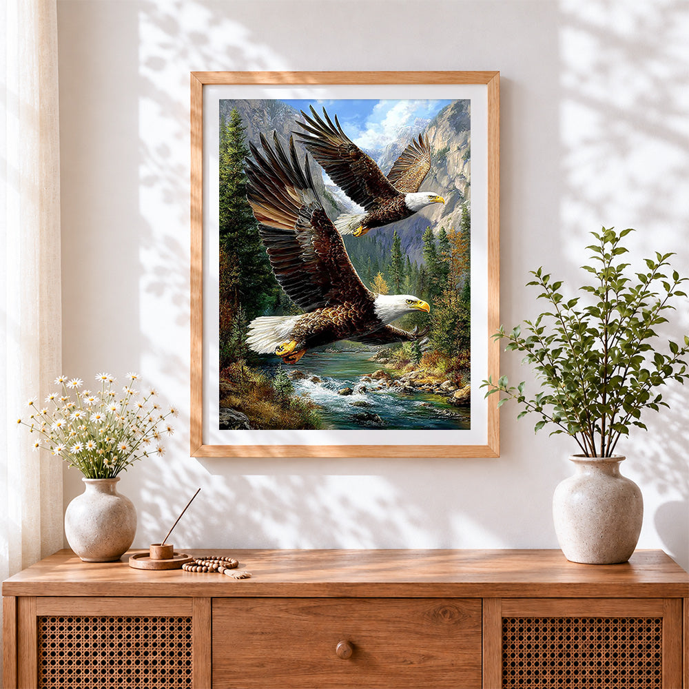 Finished majestic bald eagles in flight cross stitch artwork displayed