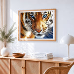 Majestic bengal tiger with blue eyes cross stitch artwork displayed on wall as home decor