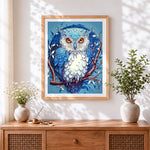Finished majestic blue and white owl paint by numbers artwork displayed as home decor