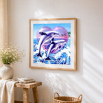 Majestic dolphins leaping from the waves cross stitch artwork displayed on wall as home decor