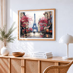 Majestic eiffel tower with pink blossoms paint by numbers artwork displayed on wall as home decor