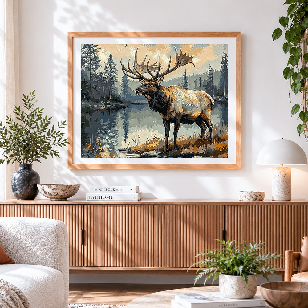 Finished majestic elk by a tranquil lake cross stitch artwork displayed