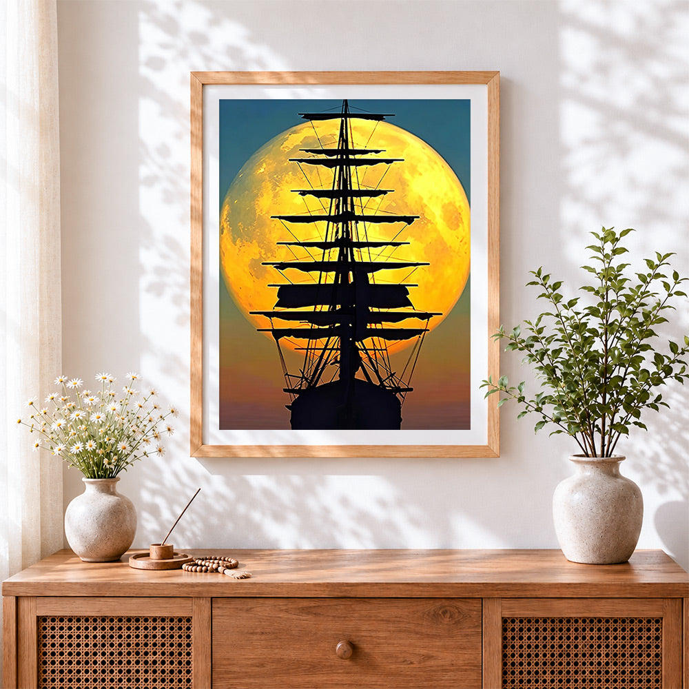 Finished majestic full moon and tall ship silhouette cross stitch artwork displayed