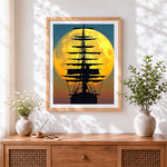 Finished majestic full moon and tall ship silhouette cross stitch artwork displayed