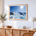Majestic glacier and snowy peaks cross stitch artwork displayed on wall as home decor