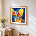 Majestic golden phoenix rising cross stitch artwork displayed on wall as home decor