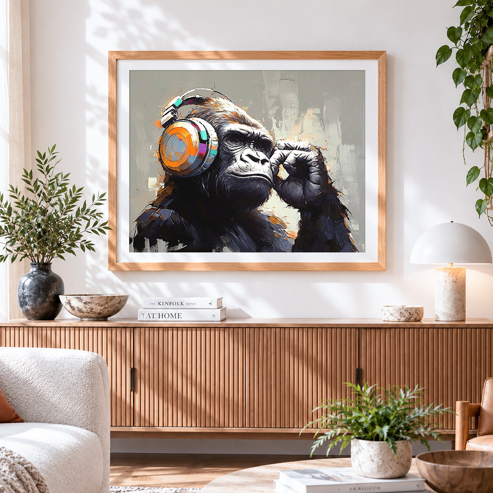 Finished majestic gorilla with headphones cross stitch artwork displayed
