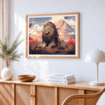 Majestic lion in a mountain landscape cross stitch artwork displayed on wall as home decor