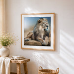 Majestic lion resting cross stitch artwork displayed on wall as home decor