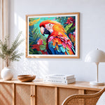 Majestic macaw with tropical flowers cross stitch artwork displayed on wall as home decor