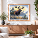 Finished majestic moose by a lake cross stitch artwork displayed