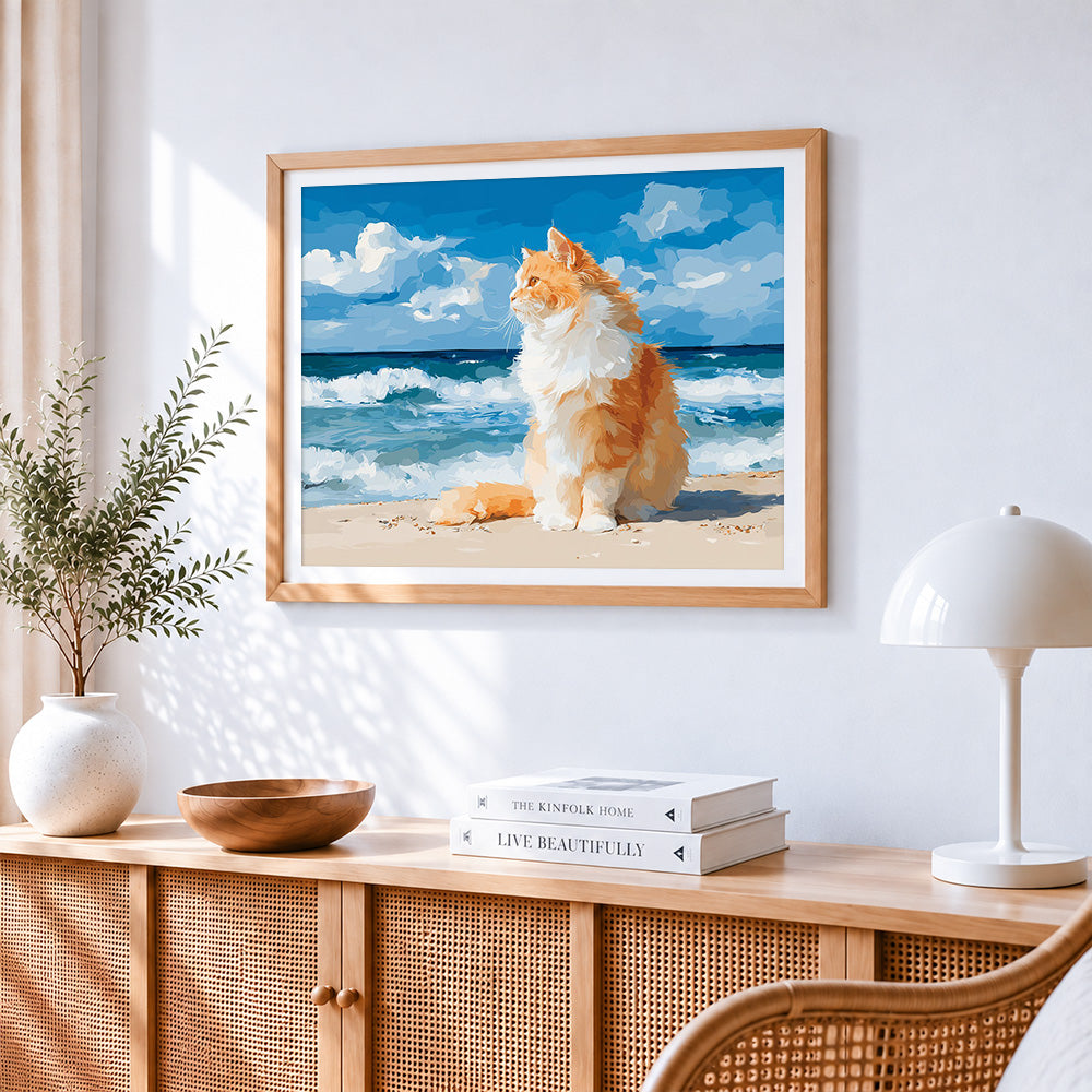 Majestic orange cat by the sea cross stitch artwork displayed on wall as home decor