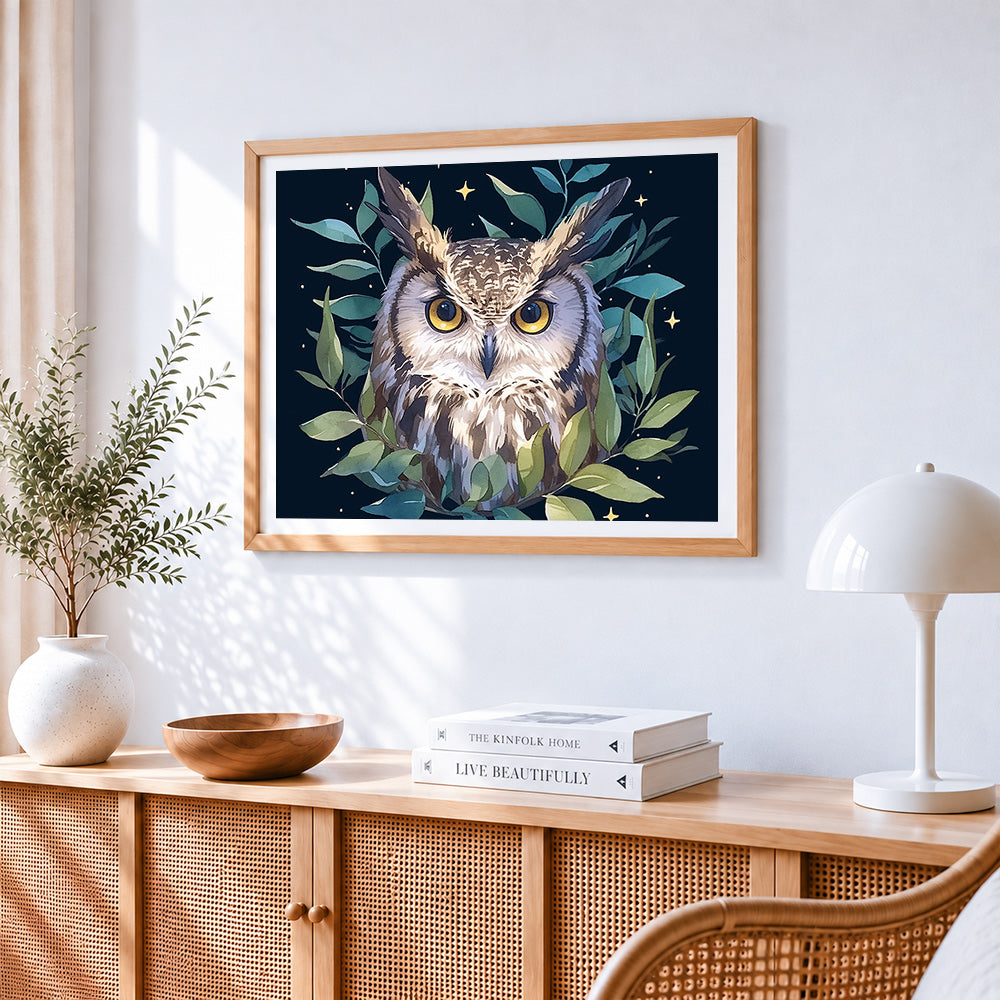 Majestic owl with green leaves cross stitch artwork displayed on wall as home decor